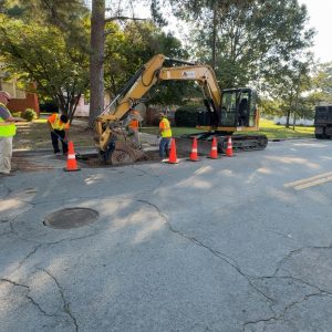 Mad Duck Construction crew patching asphalt
