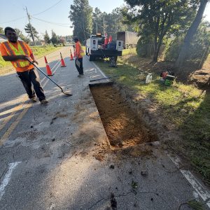 Asphalt paving crew laying a new surface